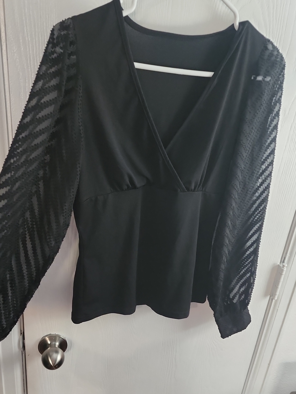 Women’s Black V-Neck Peplum Top with Sheer Patterned Sleeves